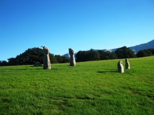 Akaroa sculpture of man in ground